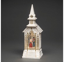 Decoratieve sneeuwbol in de vorm van een kerk met zangers