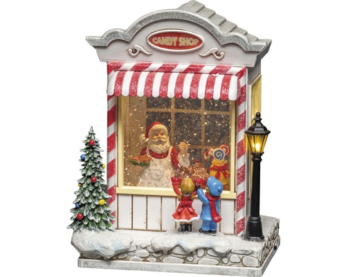 Decoratieve sneeuwbol met snoepwinkel, kerstman en kinderen als kerstdecoratie
