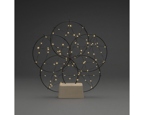 Decoratieve lamp met cirkelvormig ontwerp en ledlampjes op houten voet