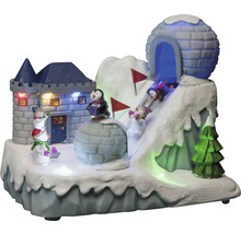 Decoratief winterlandschap met kasteel, iglo, pinguïns, sneeuwpoppen en skiërs