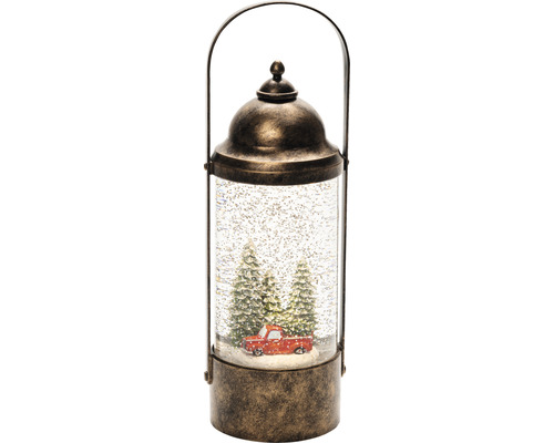 Decoratieve sneeuwbol lantaarn met rode pick-up en kerstbomen