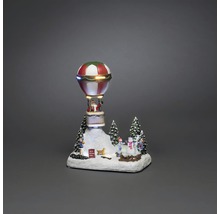 Kerstdecoratie met kerstman in luchtballon en winterlandschap
