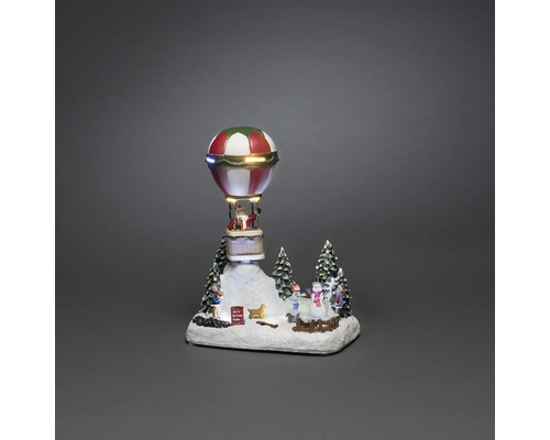 Kerstdecoratie met kerstman in luchtballon en winterlandschap