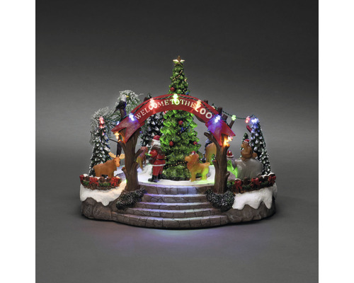 Decoratieve kerstdierentuinscène met kerstboom, figuren en verlichting