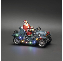 Kerstdecoratie met kerstman in oldtimer met verlichting