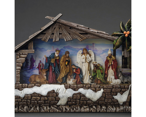 Kerststal met figuren onder een houten dak