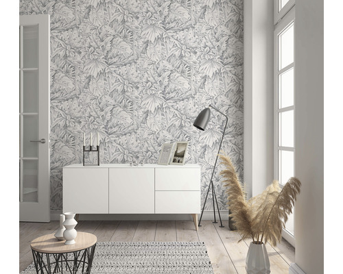 Inrichtingsidee met dressoir, vloerlamp en botanisch behang voor woonruimtes