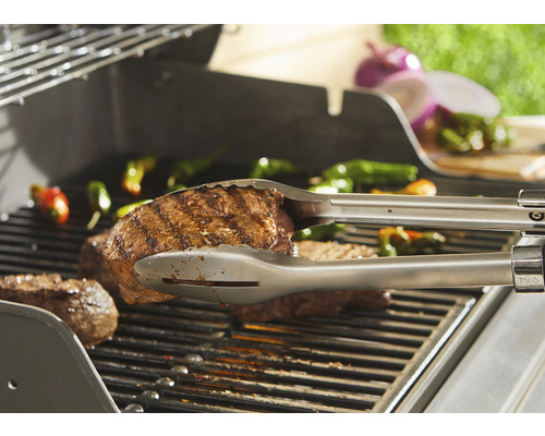 Barbecue met steak en barbecuetang