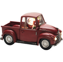 Decoratieve rode kersttruck met kerstmanfiguur
