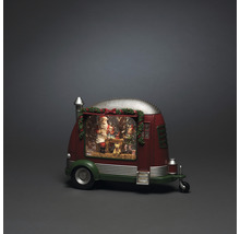 Decoratieve sneeuwbol in de vorm van een caravan met kerstman en kerstmotieven.
