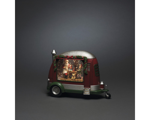 Decoratieve sneeuwbol in de vorm van een caravan met kerstman en kerstmotieven.