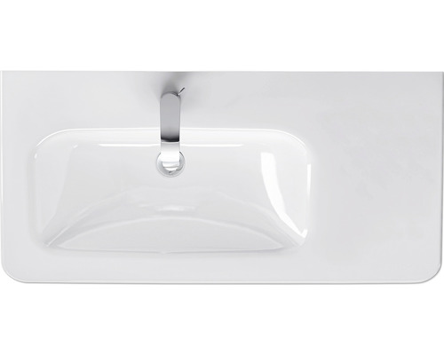 Bovenaanzicht van een witte wastafel met kraan