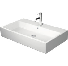 Witte keramische wastafel met kraan