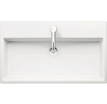 Bovenaanzicht van een witte wastafel met kraan