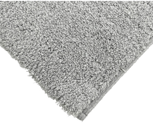 Detailopname van een grijs hoogpolig tapijt