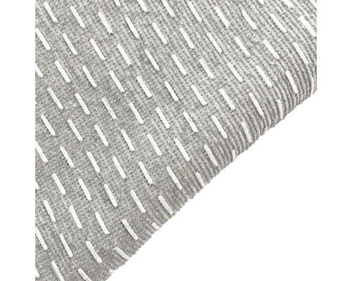 Close-up van een grijs tapijt met patroon