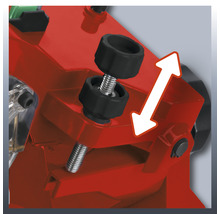 Detailopname van een zaag met stelschroef en pijl ter illustratie van de verstelbaarheid