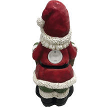 Achterkant van een kerstmanfiguur met batterijcompartiment