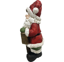 Decoratieve kerstman met cadeau