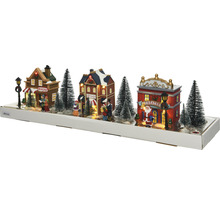 Verlichte winterdorpdecoratie met huizen en bomen