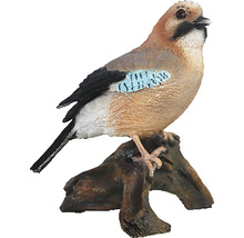 Decoratieve eeksterfiguur op een boomstronk