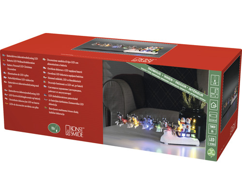 Verpakking van een LED kerstdecoratie met husky slee en sneeuwpopfiguren voor binnenshuis