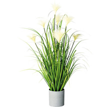 Decoratieve kunstplant in pot met gras en bloeiwijzen voor binnenshuis