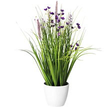 Decoratieve kunstplant met groene grassen en paarse bloemen in een witte pot