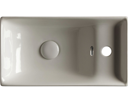 Bovenaanzicht van een rechthoekige wastafel met overloop en afvoergarnituur