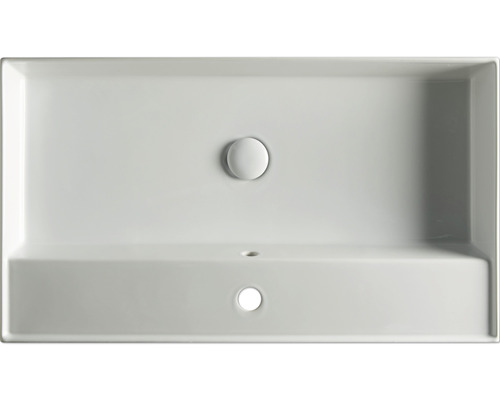 Bovenaanzicht van een rechthoekige wastafel met kraangat en overloop