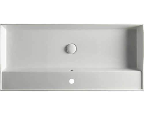 Bovenaanzicht van een rechthoekige wastafel van keramiek met afvoerstop en kraangat