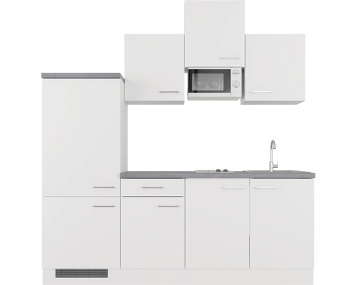 Moderne keuken met witte kasten, spoelbak en magnetron