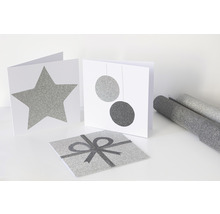 Decoratieve kaarten met ster-, kogel- en cadeauontwerpen, evenals decoratieve folie
