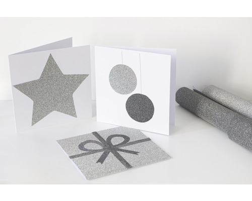 Decoratieve kaarten met ster-, kogel- en cadeauontwerpen, evenals decoratieve folie