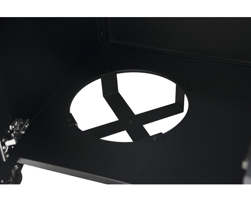 Detail van een ronde opening in een zwarte metalen constructie