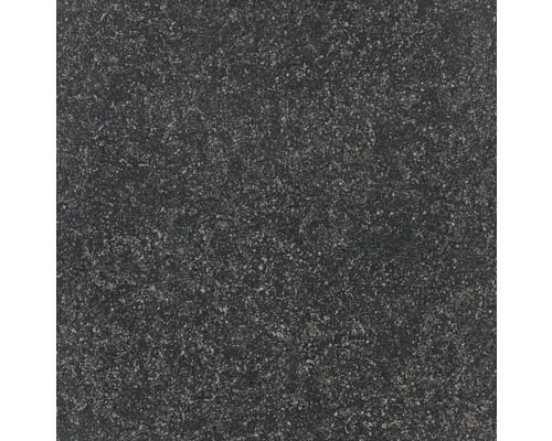 Close-up van een vloertegel met een gespikkelde textuur