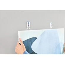 Een schilderij ophangen met een schilderijhaak aan de muur