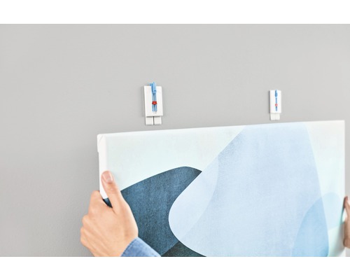 Een schilderij ophangen met een schilderijhaak aan de muur