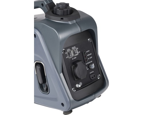 Detailopname van een stroomgenerator met schakelaars, stopcontact en controlelampjes