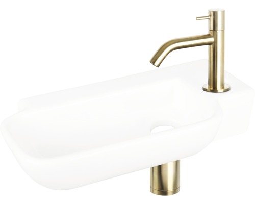 Witte wastafel met goudkleurige kraan voor de badkamer
