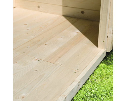 Detailopname van de houten vloer van een tuinhuis