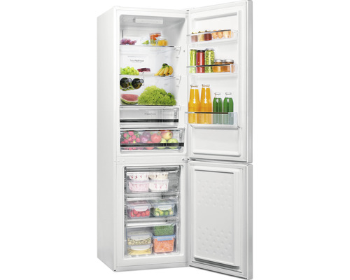 Geopende witte koelkast met levensmiddelen