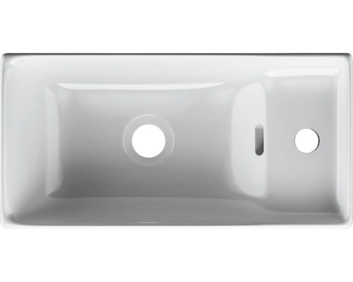 Wastafel van sanitair keramiek met kraangat en overloop