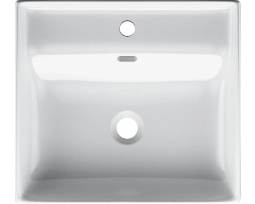 Bovenaanzicht van een witte keramische wastafel met kraangat en overloop