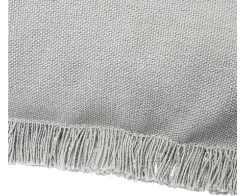 Detail van een vloerkleed met franjes