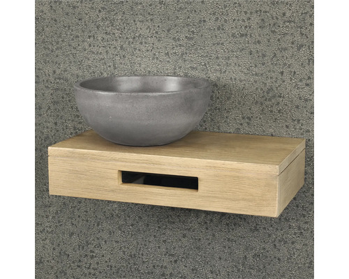 Betonnen wastafel op een houten plank