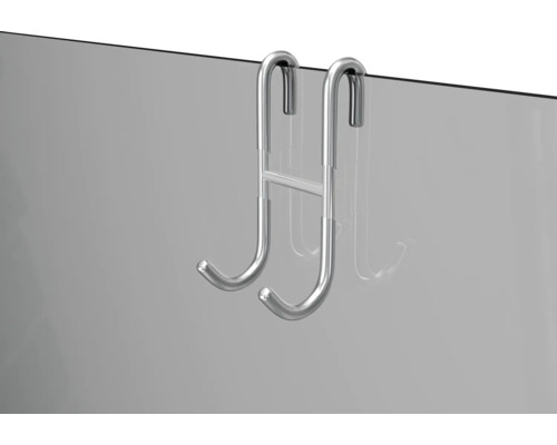 Metalen deurhanger aan een glazen deur