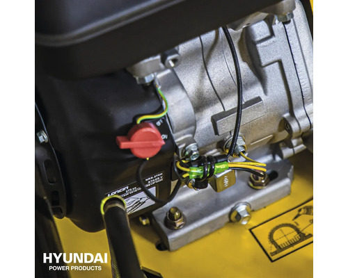 Detailopname van een Hyundai Power Products motor met rode schakelaar