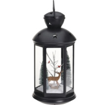 Decoratieve lantaarn met hertenfiguren en bomen voor de kerstperiode