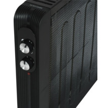 Detailweergave van een zwarte radiator met temperatuurregelaars